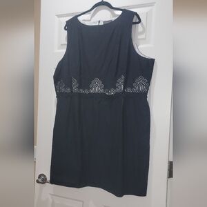 Black Sleeveless dress with pockets and lace midsection.